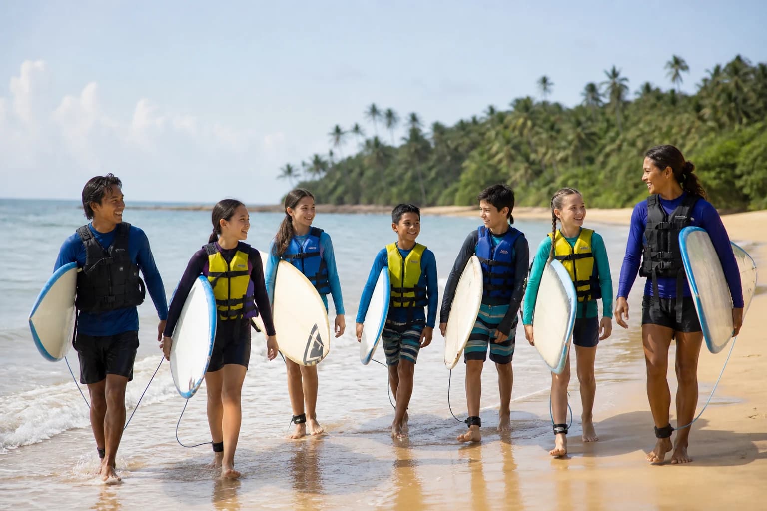 Illustrative photo: teenagers at a supervised surfing session