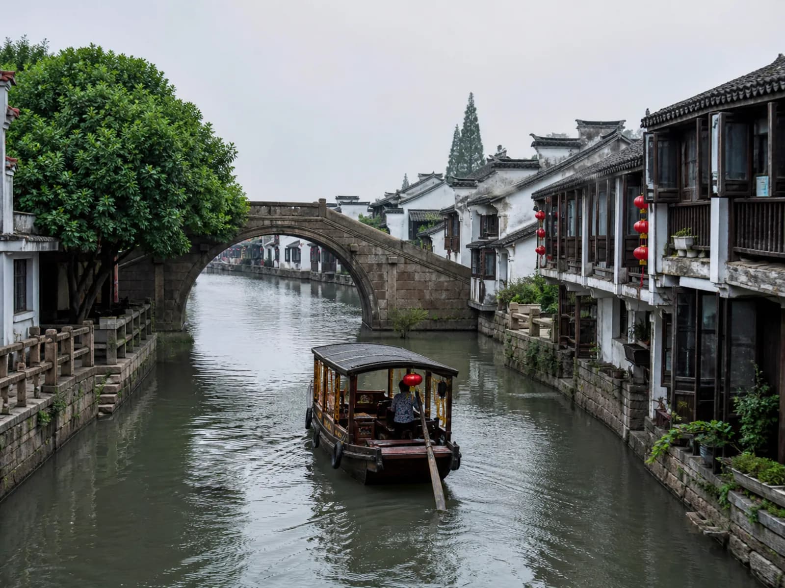 Illustrative photo: a canal and stone bridge in ancient Luzhi